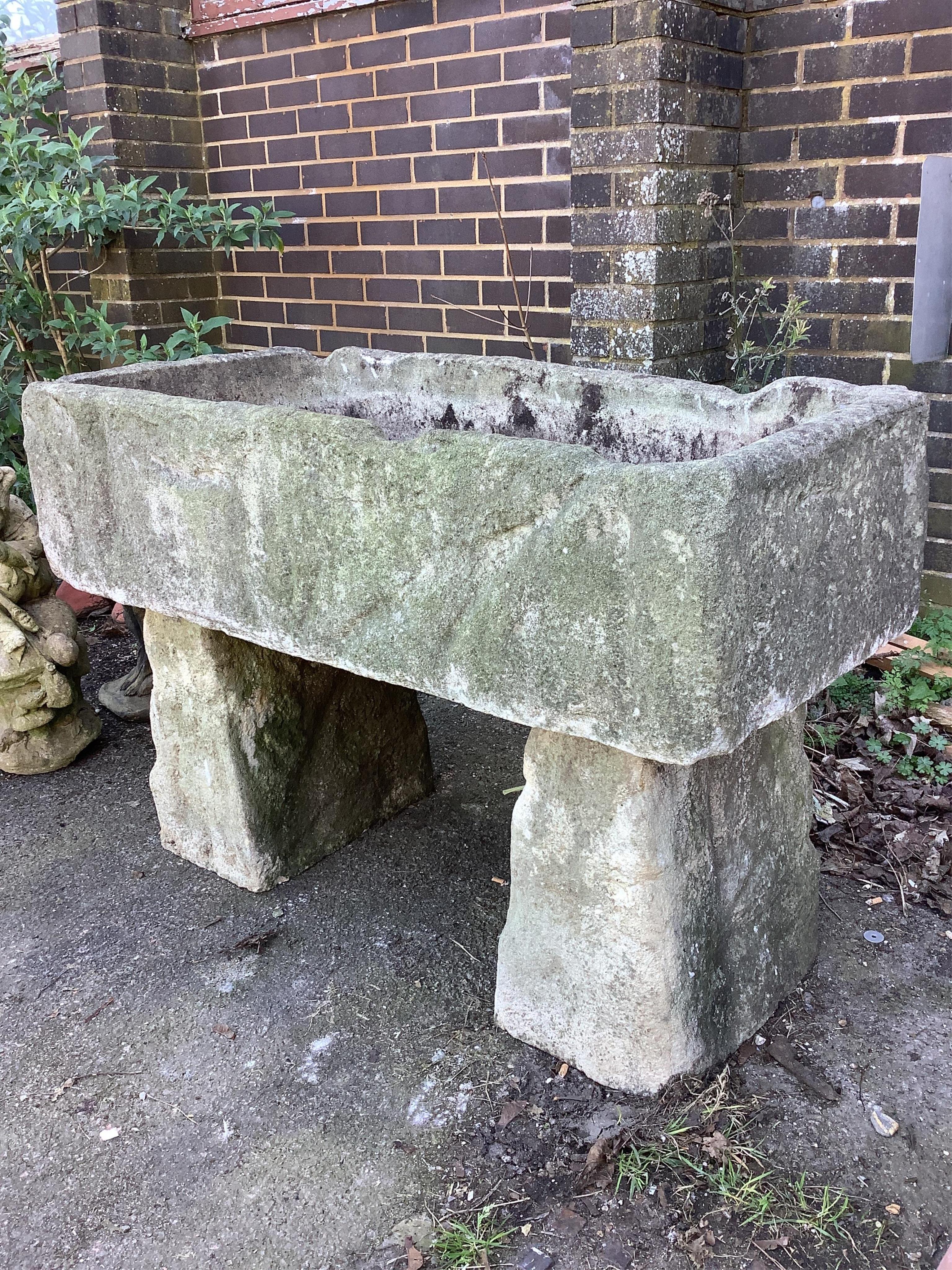 A stone trough, width 122cm, depth 60cm, height 84cm. Condition - fair
